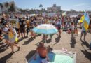 ‘Tourists go home!’ Terrified beach-goers mobbed by hundreds of protesters in Tenerife