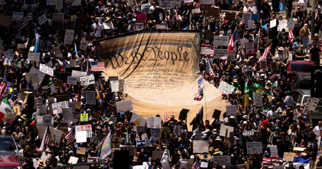 Trump presides over a military parade amid turmoil at home and abroad