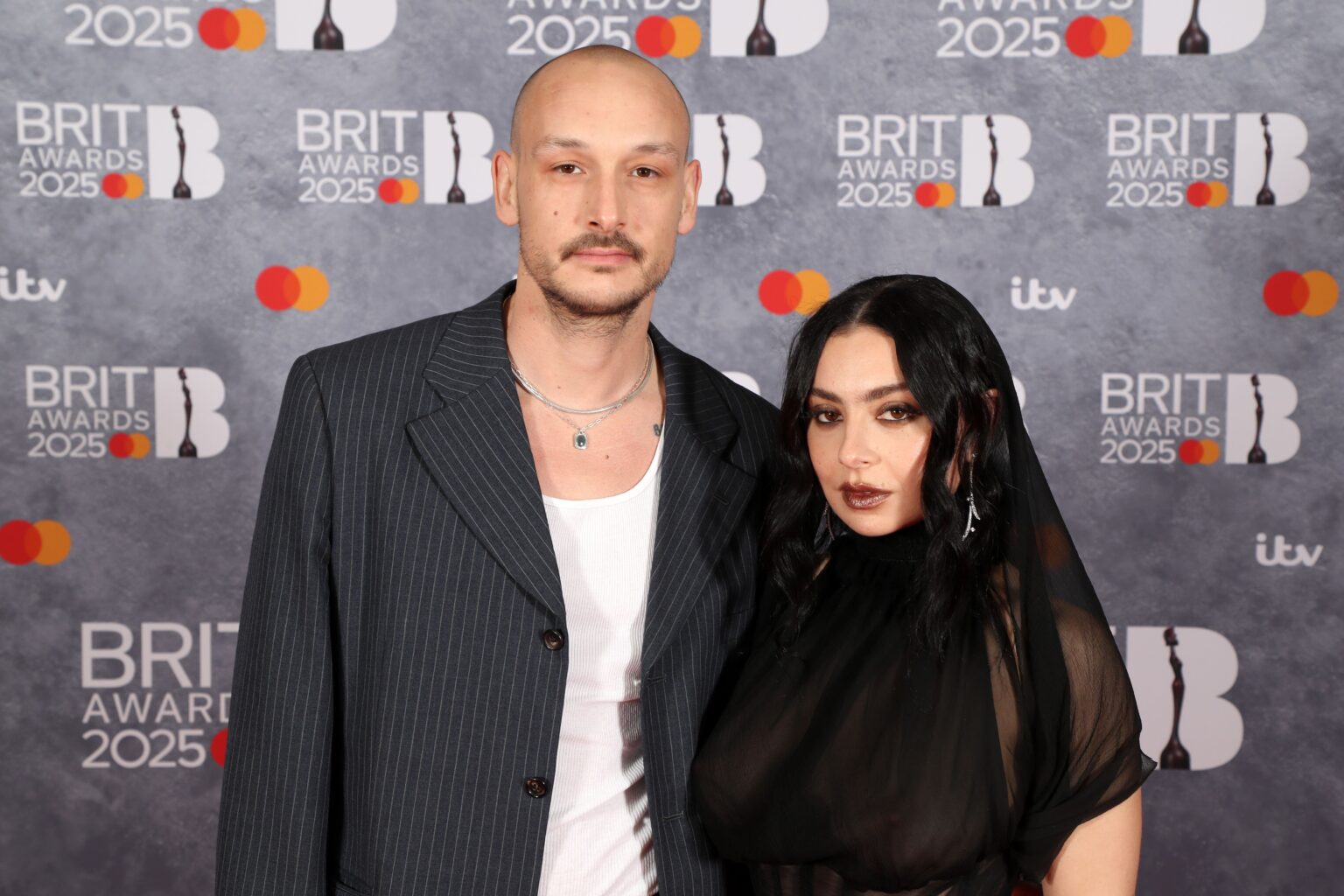 Charli XCX Trades Her Black Veil For a Bridal Minidress to Marry 1975 Drummer George Daniel