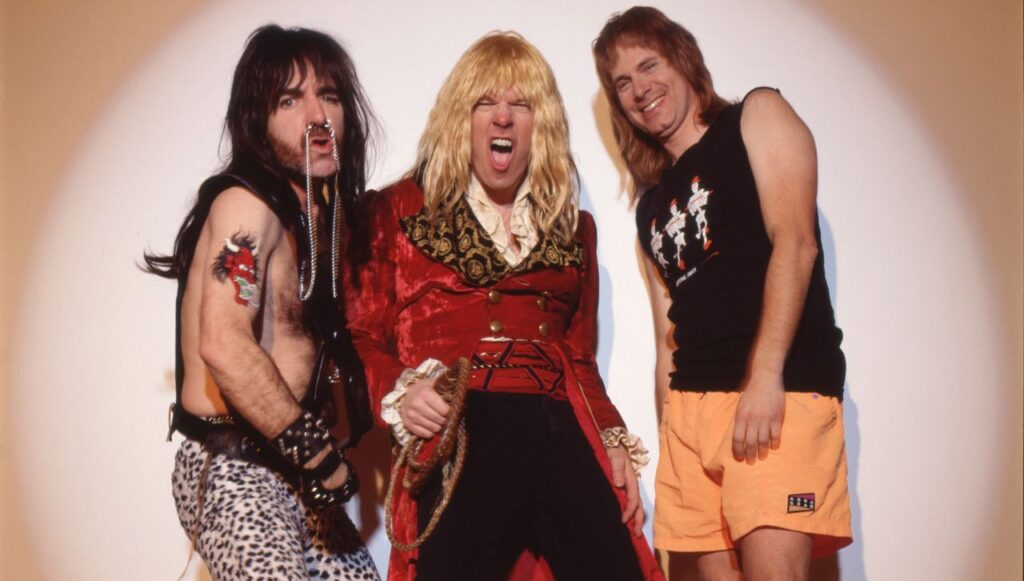 “I don’t like auditions. Let those boys like Beck and Clapton fight it out with each other. Let me watch and laugh”: Spinal Tap discuss all-star guitar duels, (maybe) influencing the Beatles, and persevering through multiple sudden tragedies