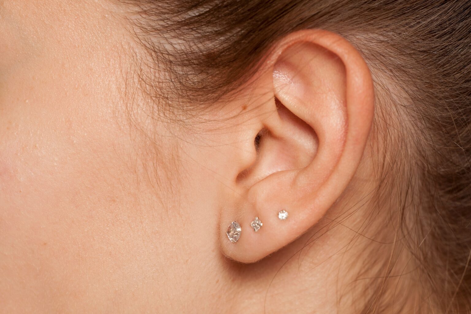 Here’s How to Treat an Infected Ear Piercing, According to Experts