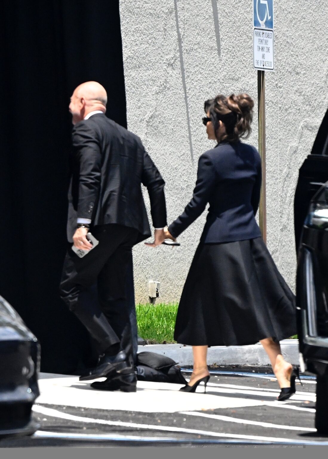Jeff Bezos gets support from Lauren Sanchez as they arrive hand-in-hand at his mom’s funeral