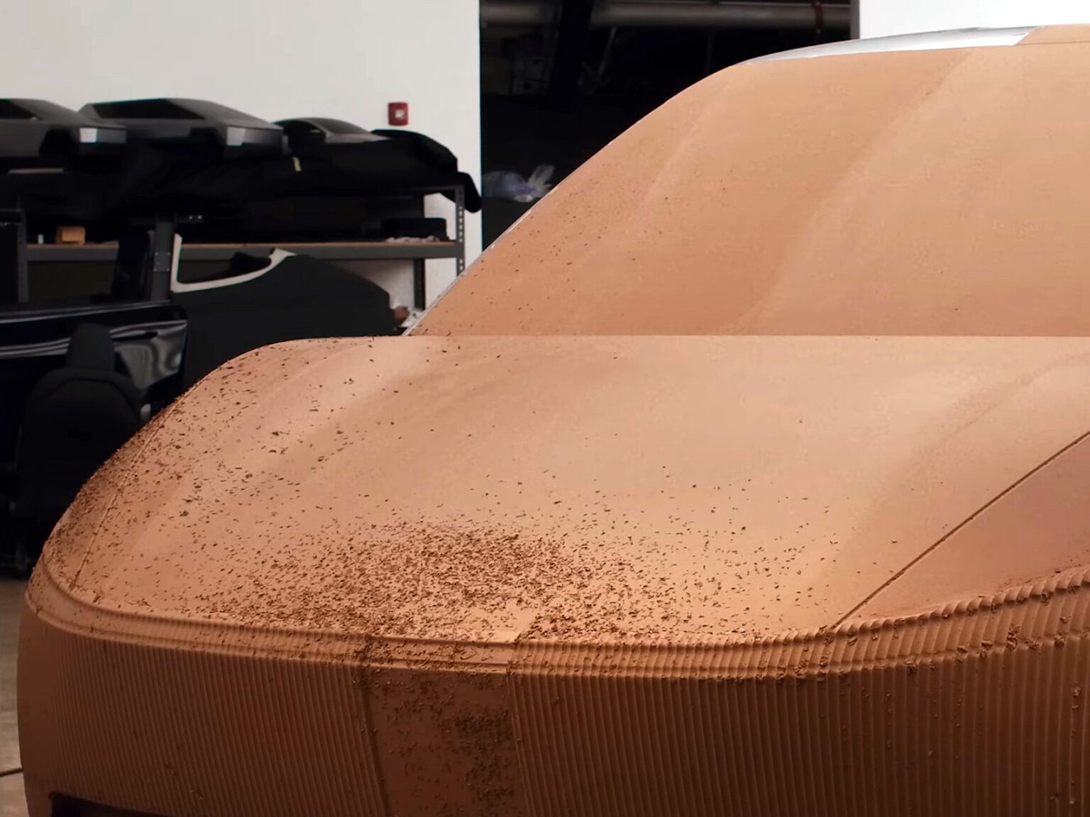 Tesla prototypes mystery 3-row SUV with edgy Cybertruck stainless steel design