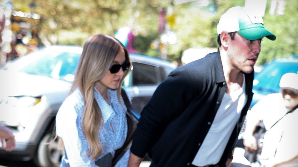 Sydney Sweeney Looks All Business in Short Skirt, Holds Scooter Braun’s Hand