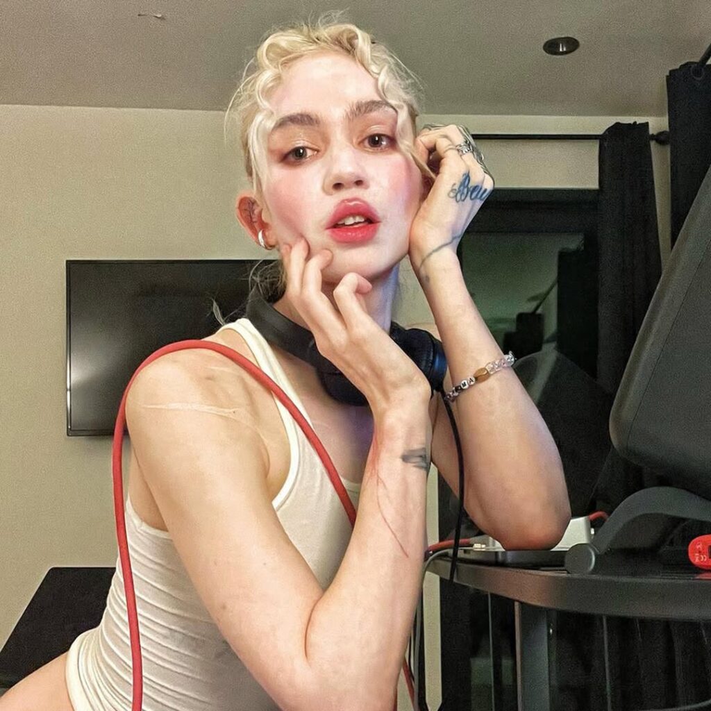 Grimes’ Face Tattoo: Photo, Meaning