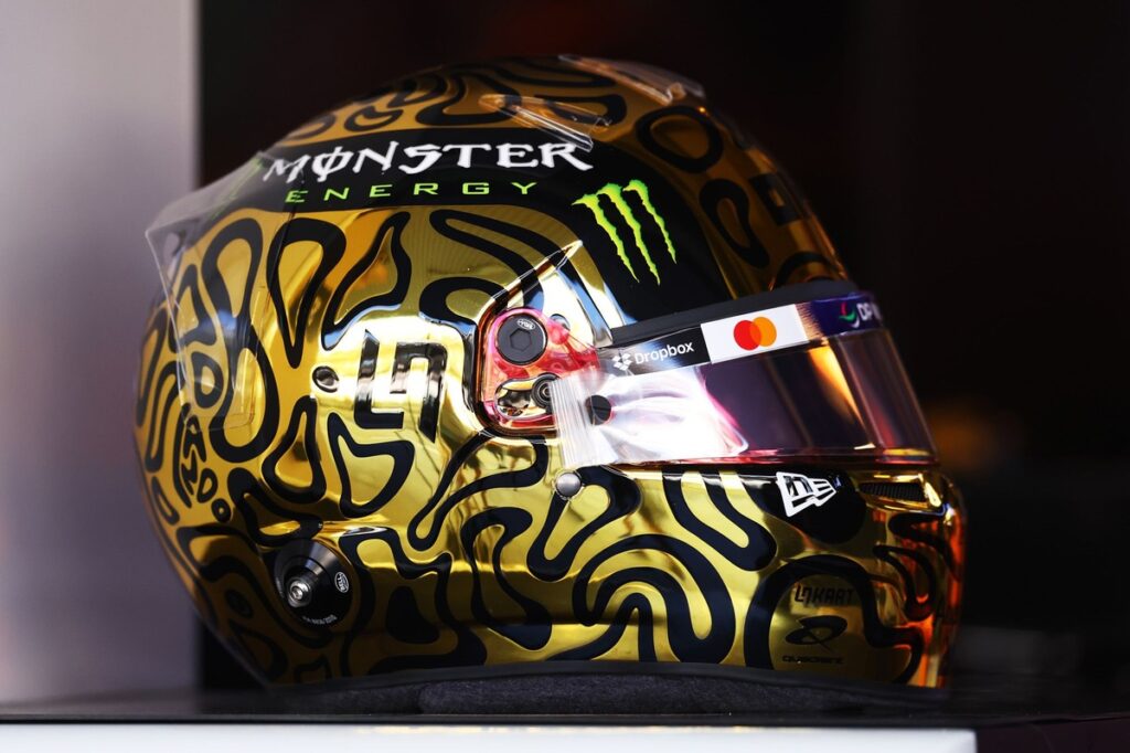 Lando Norris unveils gold helmet to celebrate first F1 world title