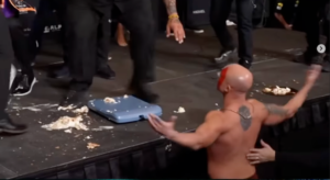 BKFC fighter falls off stage after attempting to throw giant cannoli at opponent