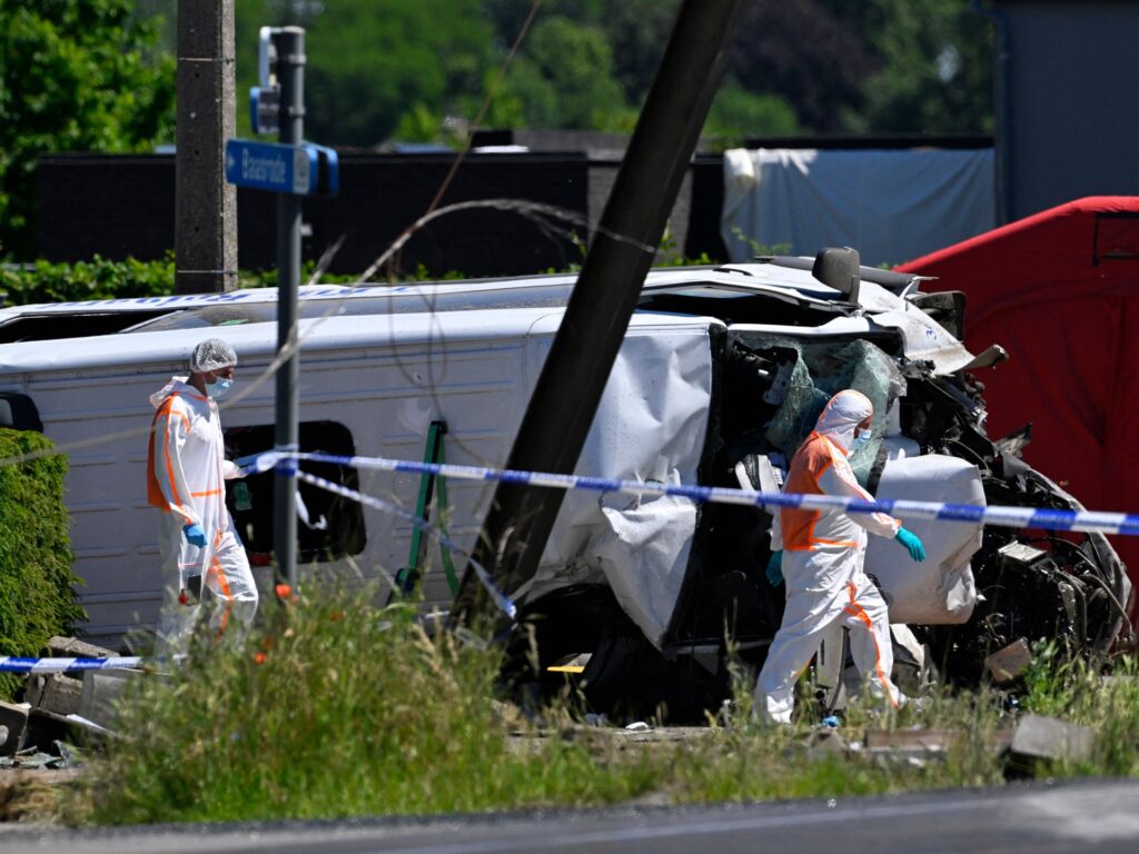 Four people killed after minibus collides with train in Belgium Four people killed after minibus collides with train in Belgium