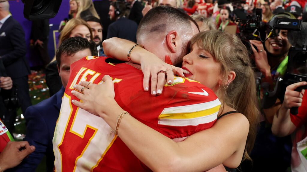 Taylor Swift-Travis Kelce Wedding Details Emerge: An Original Adam Sandler Song, “Blank Space” Handkerchiefs at “Intimate” Garden Ceremony