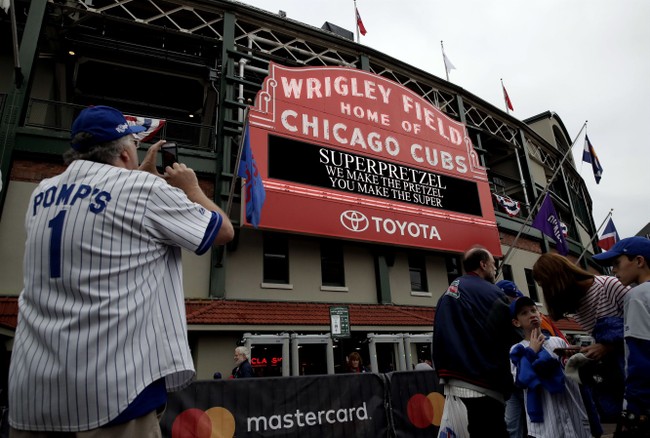 Video of Older Chicago Cubs Fan Popping Younger Man for Sitting During National Anthem Divides Internet Video of Older Chicago Cubs Fan Popping Younger Man for Sitting During National Anthem Divides Internet