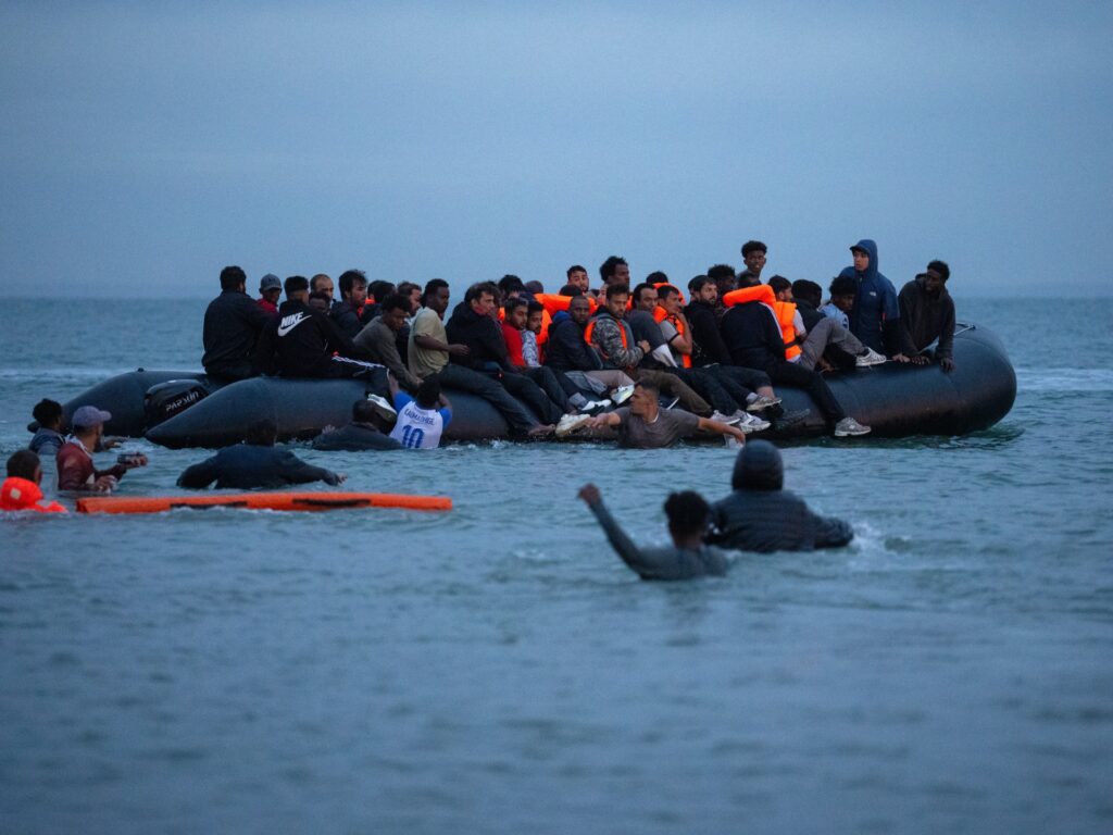 Record 230 people reach UK on single boat after crossing English Channel Record 230 people reach UK on single boat after crossing English Channel